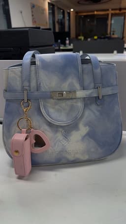 Silver hardware bag with pink charm