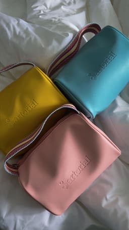 Vanity case bag on a white sheet
